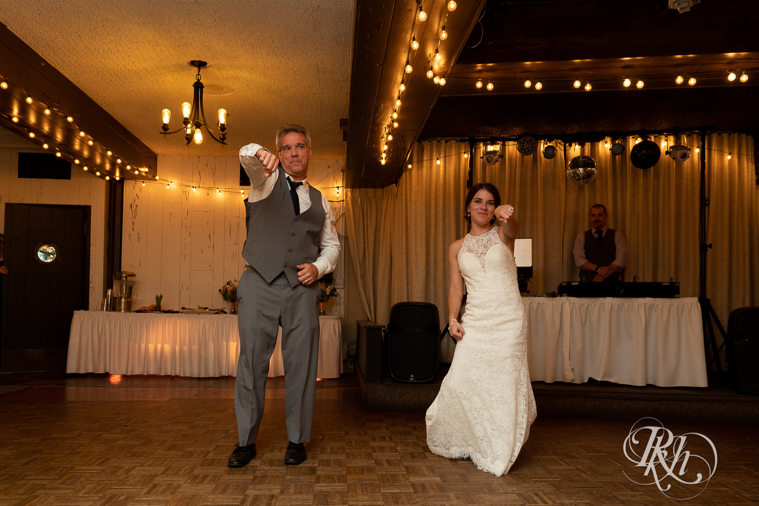 Bride and her dad dance during wedding reception at The Chart House in Lakeville, Minnesota.