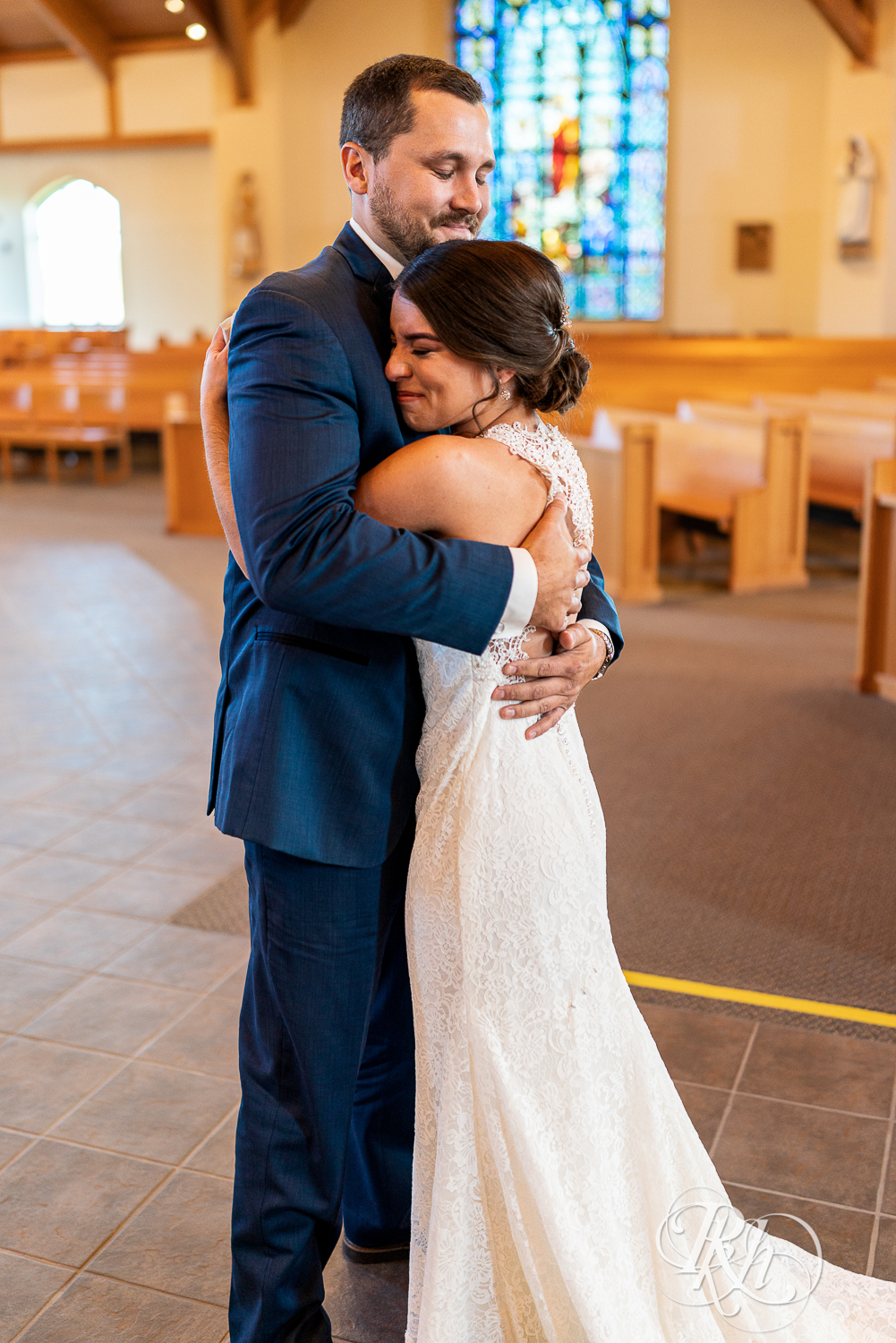 First look with bride and groom at Saint Joseph Catholic Church in Rosemount, Minnesota.