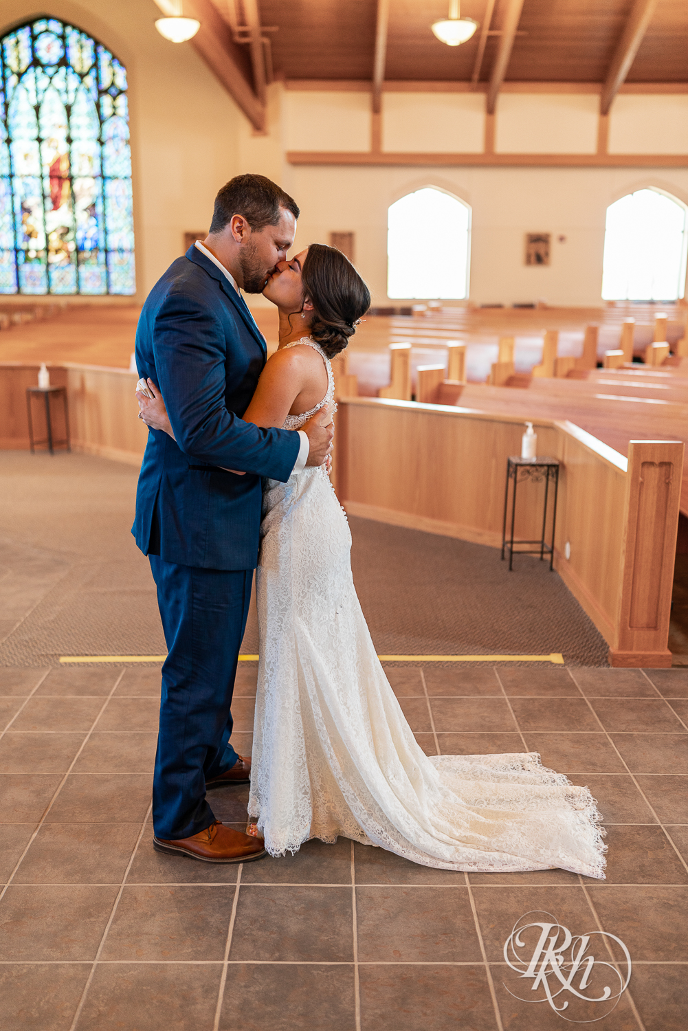 First look with bride and groom at Saint Joseph Catholic Church in Rosemount, Minnesota.