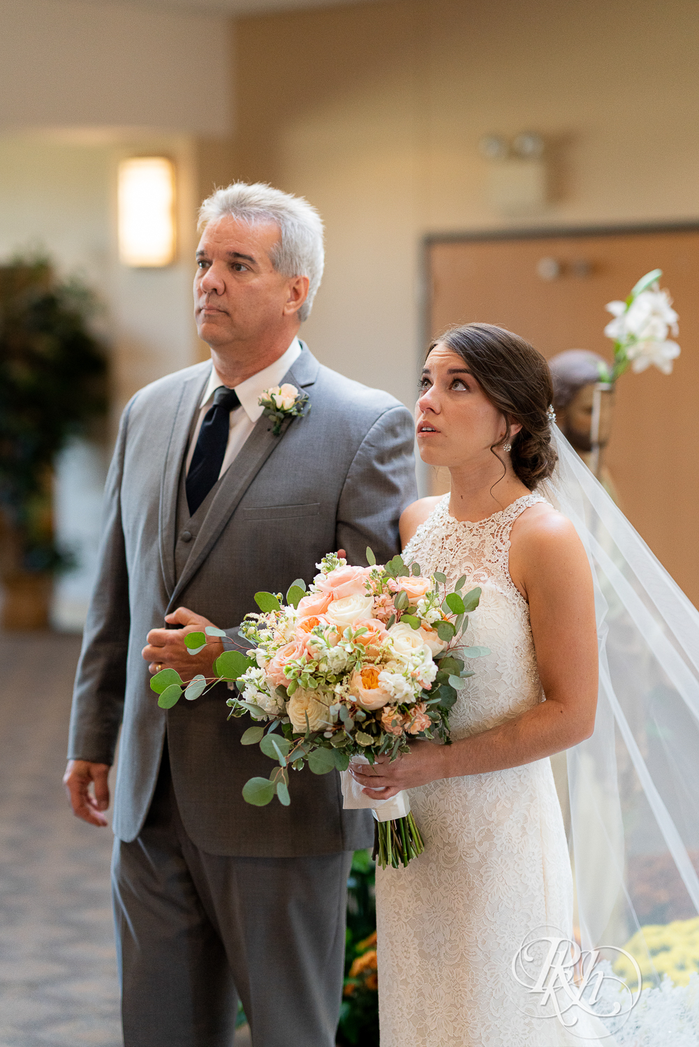 Bride walking down the aisle with father at Saint Joseph Catholic Church in Rosemount, Minnesota.