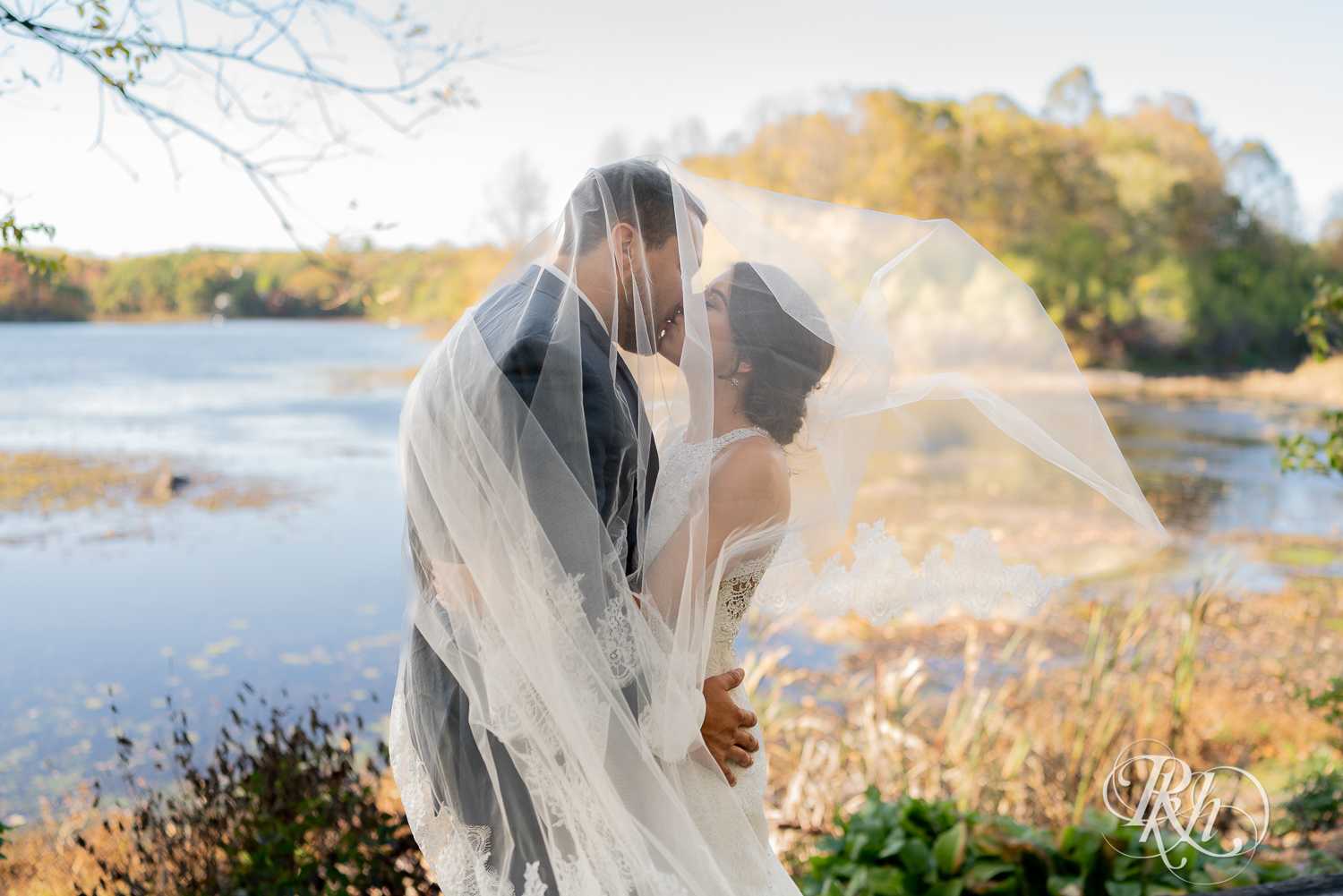 Bride and groom under the veil at The Chart House in Lakeville, Minnesota.