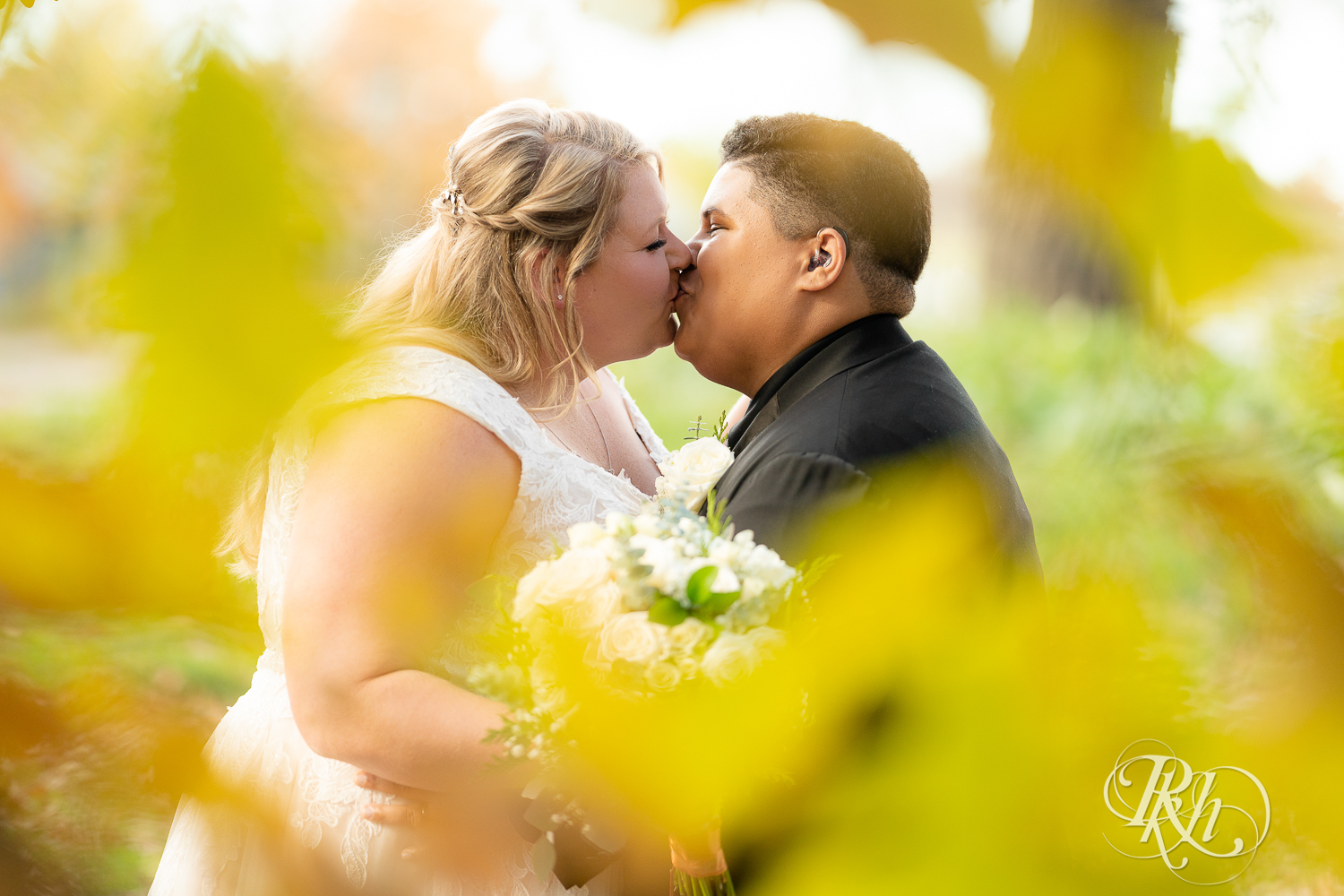 Eagan Community Center wedding brides kissing in leaves