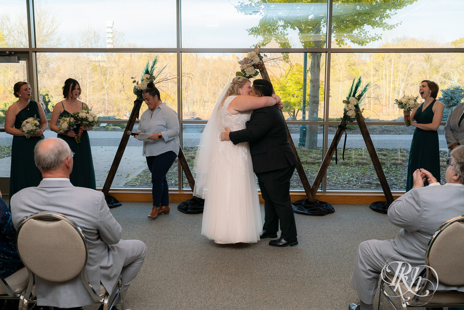Indoor lesbian wedding ceremony at Eagan Community Center in Eagan, Minnesota.