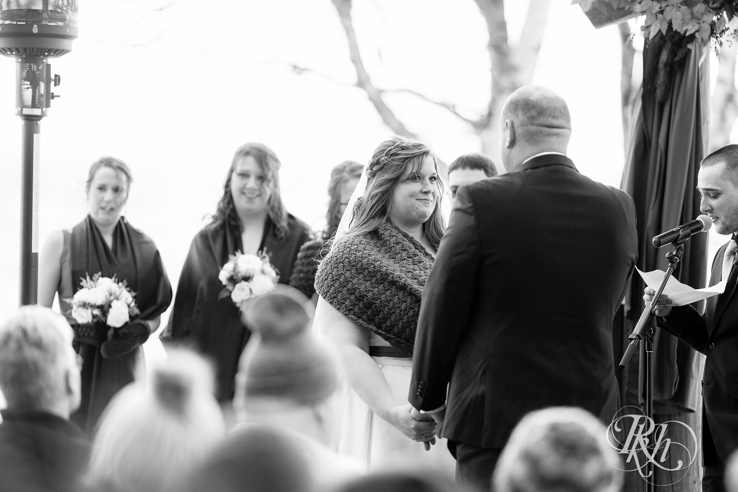 Outdoor winter wedding ceremony in the snow at Grand Superior Lodge in Two Harbors, Minnesota.