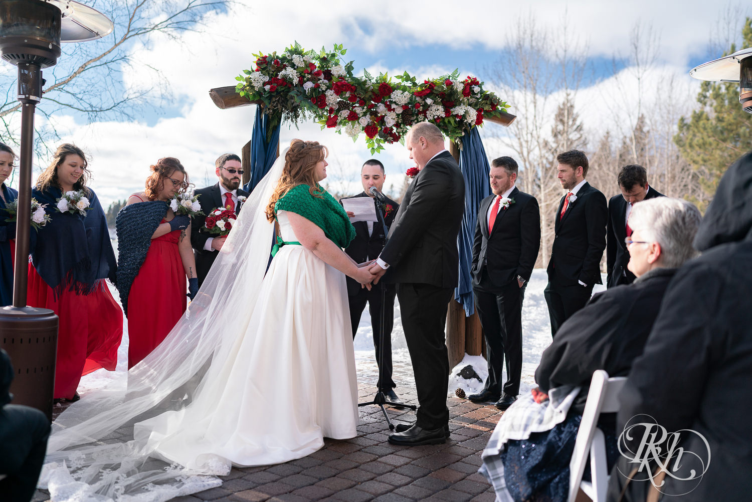Outdoor winter wedding ceremony in the snow at Grand Superior Lodge in Two Harbors, Minnesota.