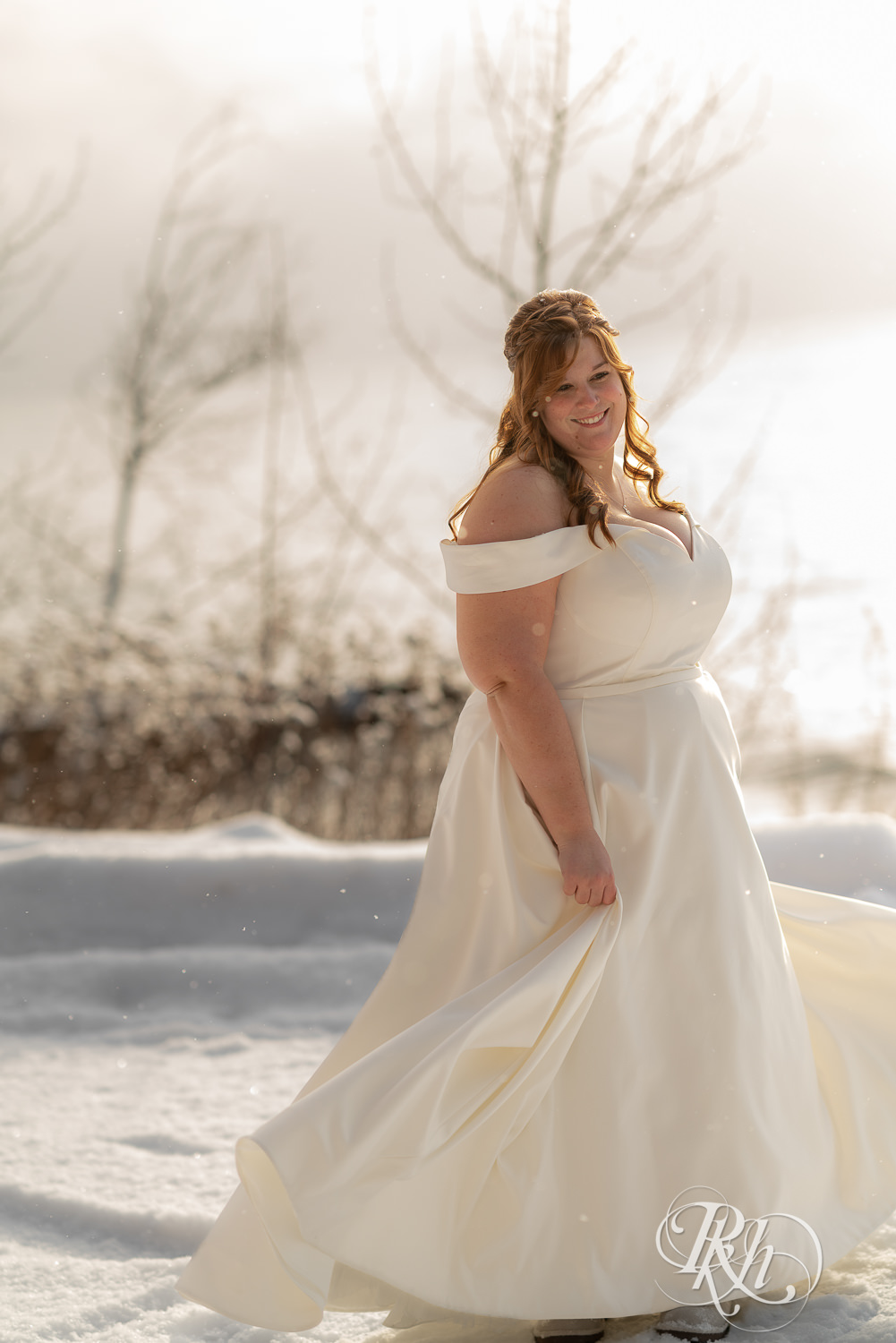 Bride dancing in the snow at Grand Superior Lodge in Two Harbors, Minnesota.
