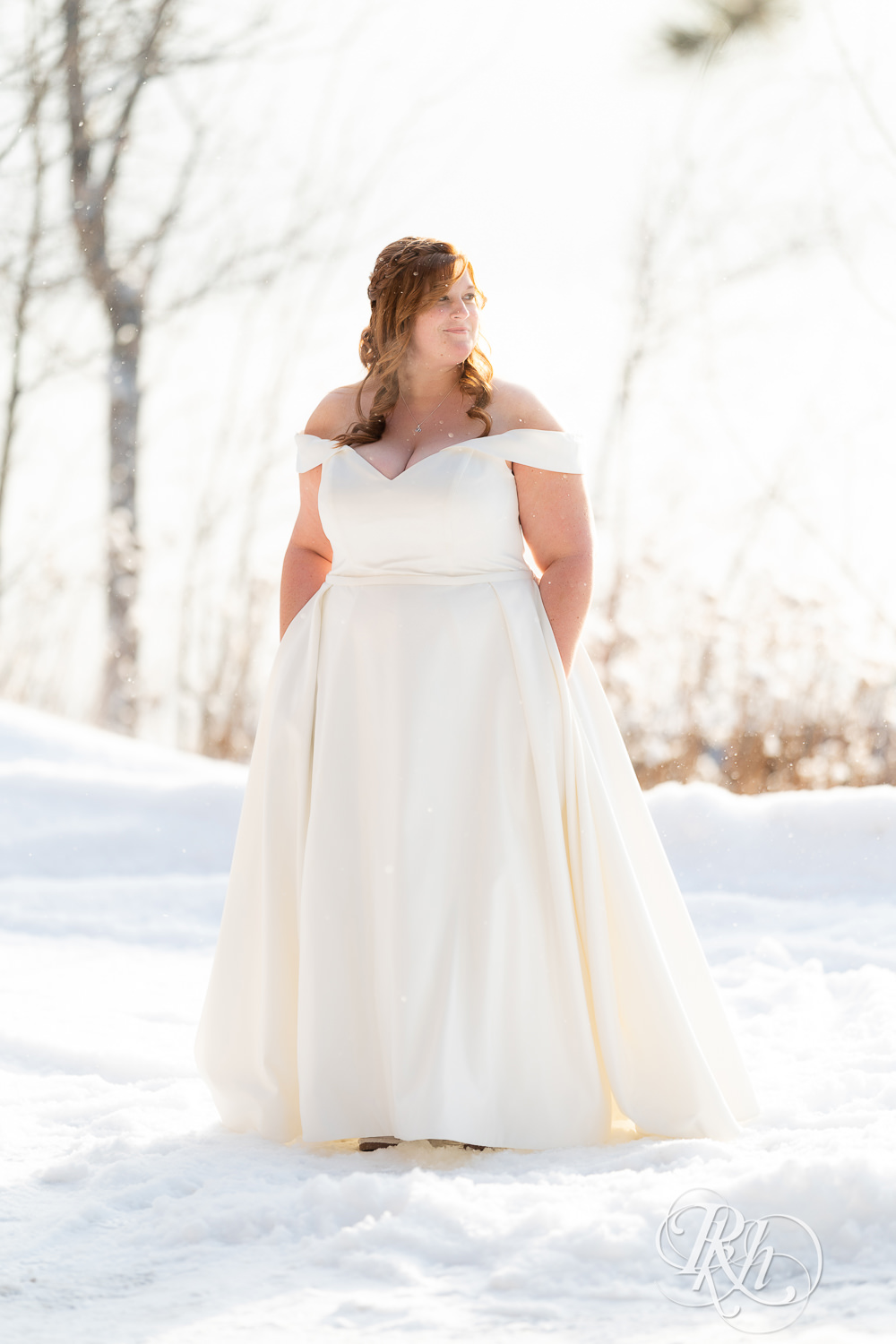 Bride dancing in the snow at Grand Superior Lodge in Two Harbors, Minnesota.