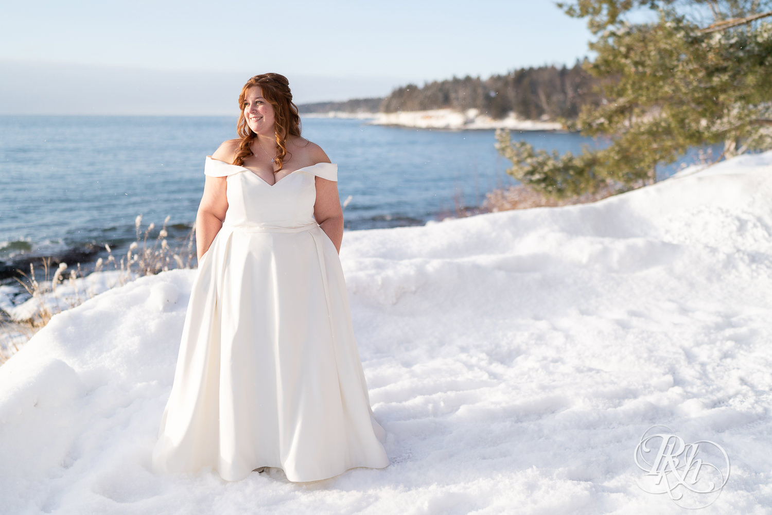 Bride standing in the snow at Grand Superior Lodge in Two Harbors, Minnesota.