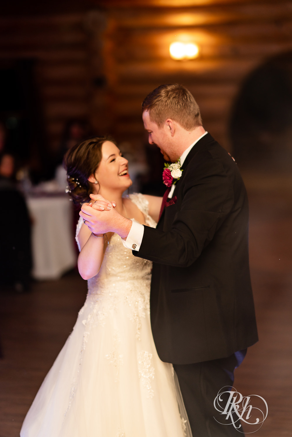 Bride and groom share first dance at wedding reception at Glenhaven Events in Farmington, Minnesota.