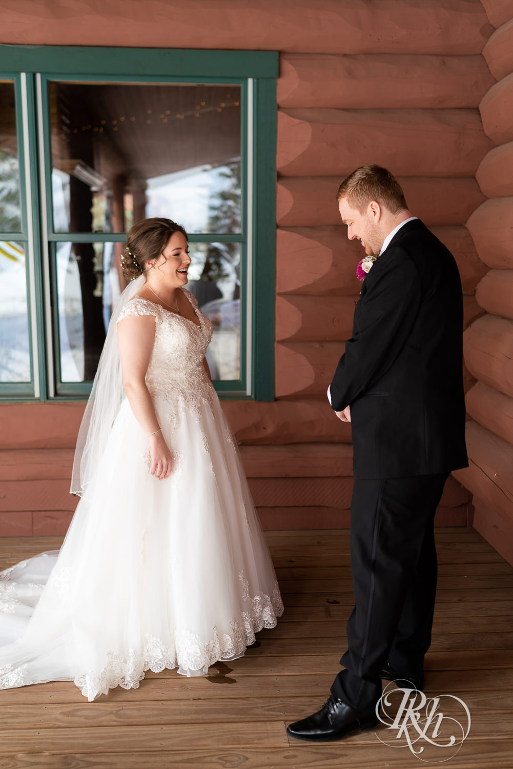 First look between bride and groom at Glenhaven Events in Farmington, Minnesota.
