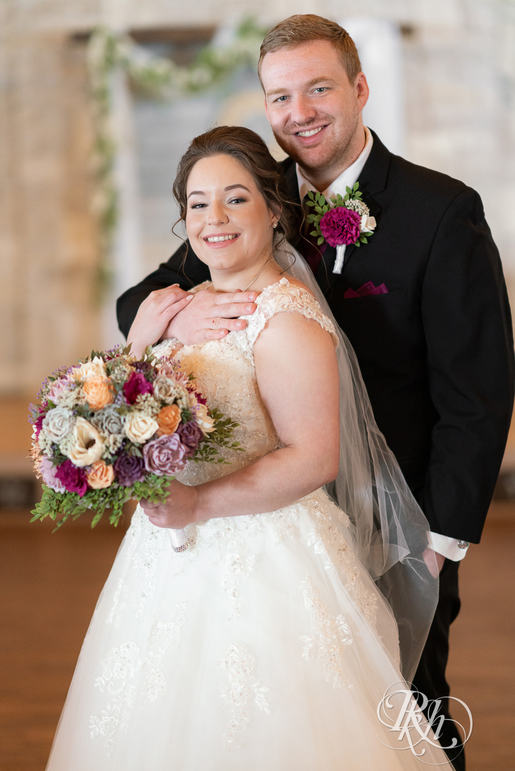 Bride and groom smiling at Glenhaven Events in Farmington, Minnesota.
