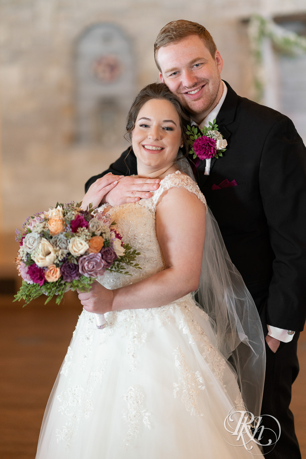 Bride and groom smiling at Glenhaven Events in Farmington, Minnesota.
