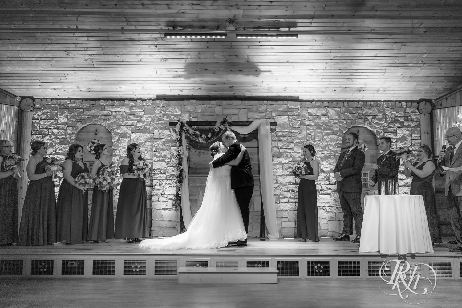 Indoor winter wedding ceremony at Glenhaven Events in Farmington, Minnesota.