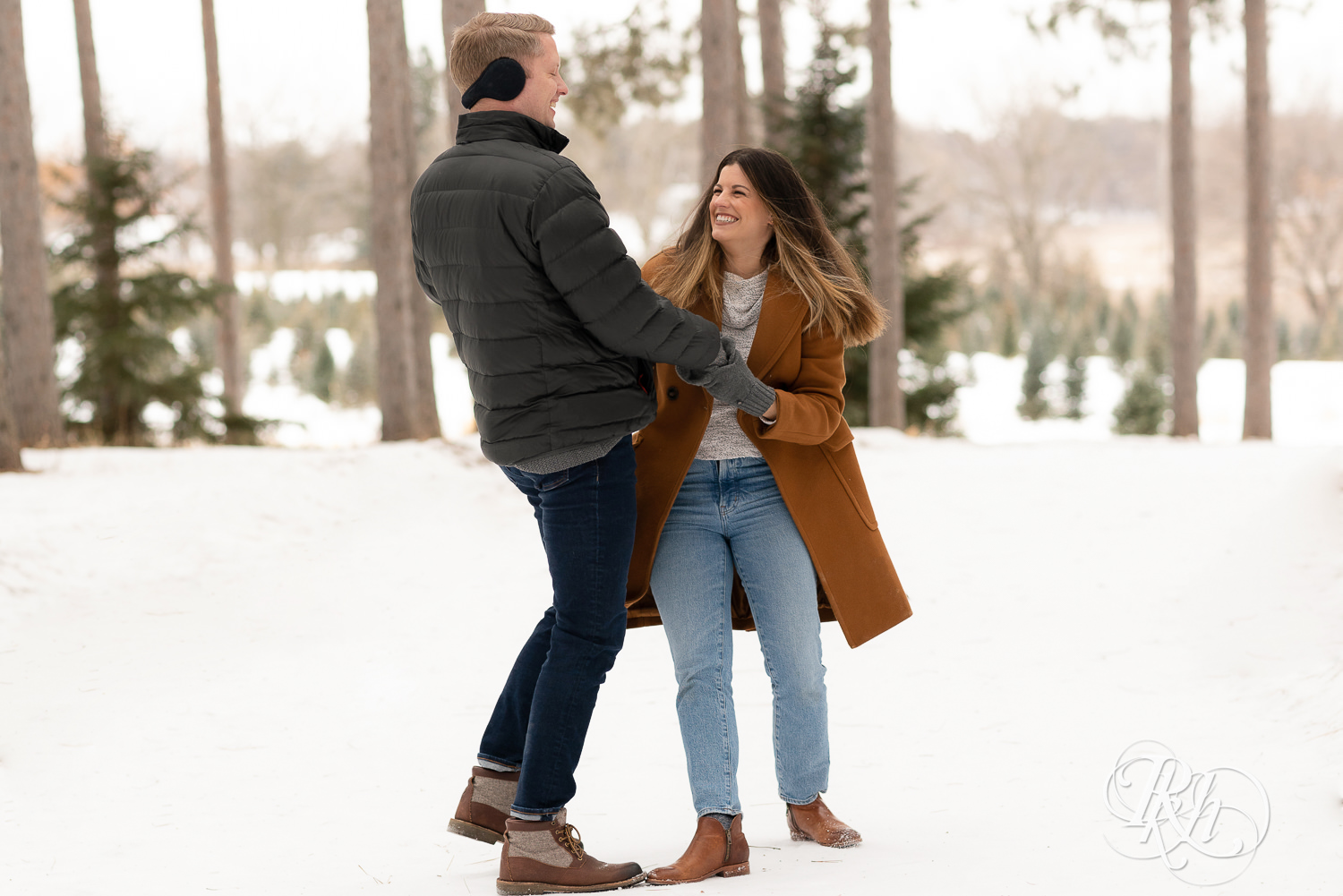 Man and woman dancing in the snow at Hansen Tree Farm in Anoka, Minnesota.