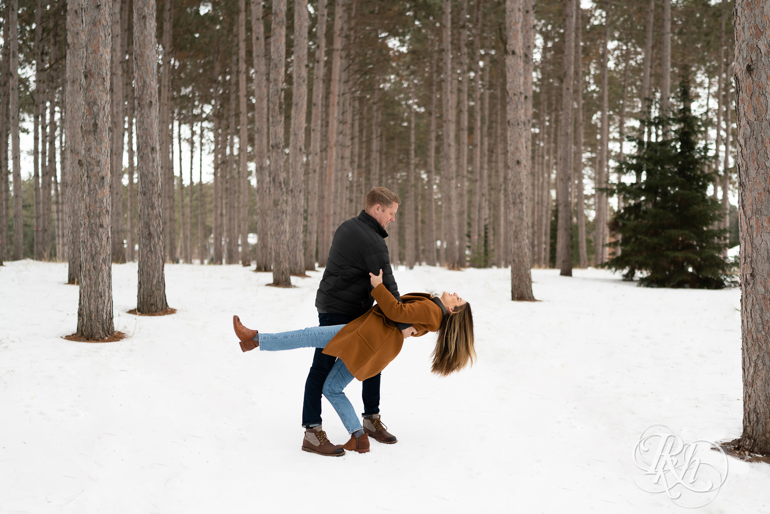 Man and woman laughing in the snow at Hansen Tree Farm in Anoka, Minnesota.