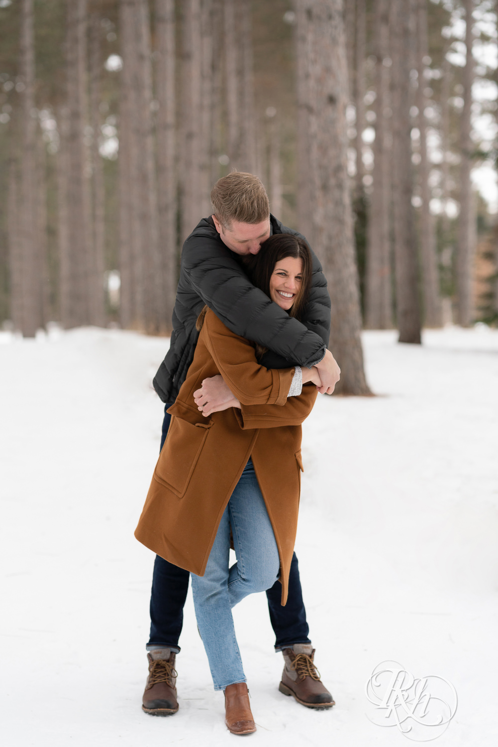 Man and woman laughing in the snow at Hansen Tree Farm in Anoka, Minnesota.