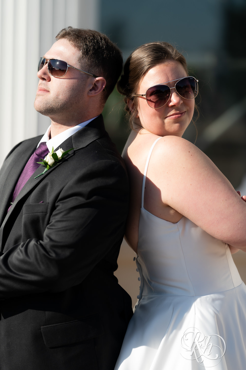 Bride and groom wearing sunglasses at wedding at Como Zoo in Saint Paul, Minnesota.
