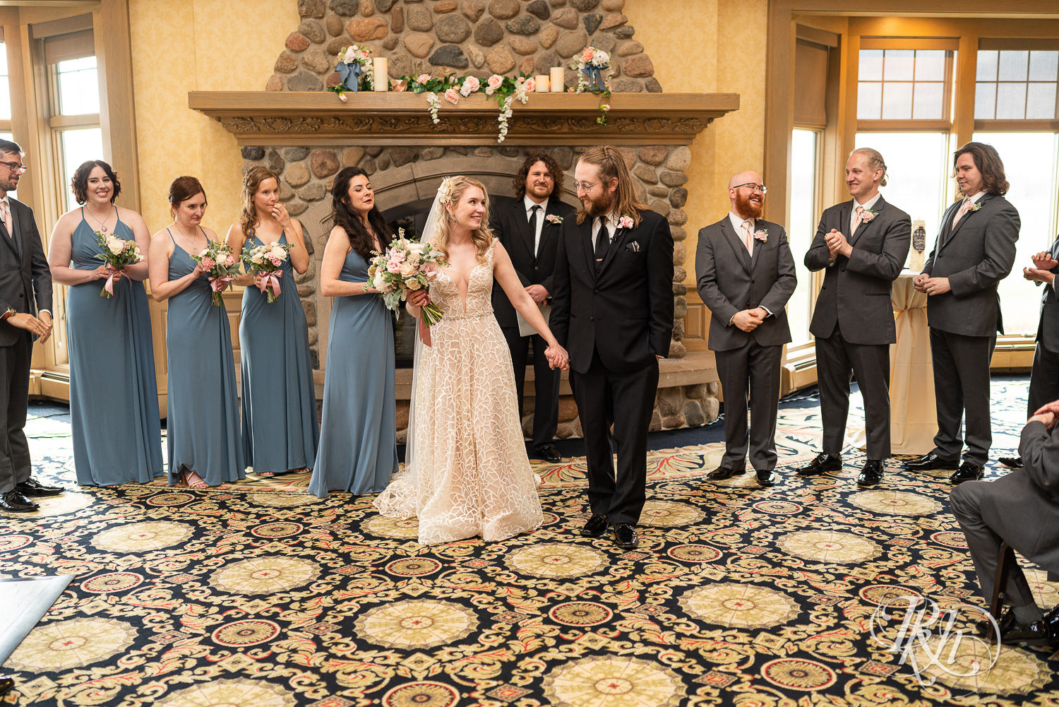 Indoor wedding ceremony takes place at Rush Creek Golf Club in Maple Grove, Minnesota.
