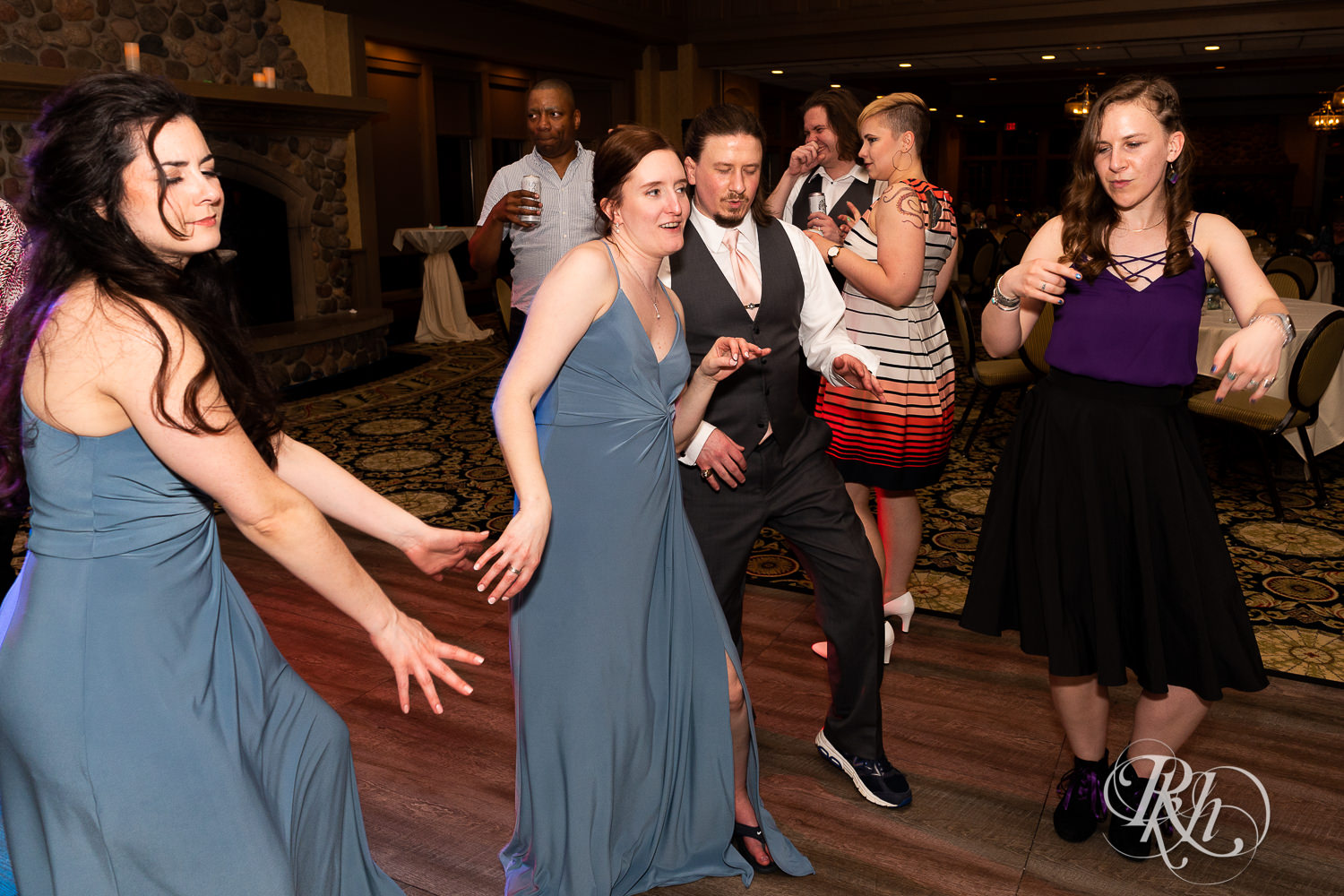 Guests dance at wedding reception at Rush Creek Golf Club in Maple Grove, Minnesota.