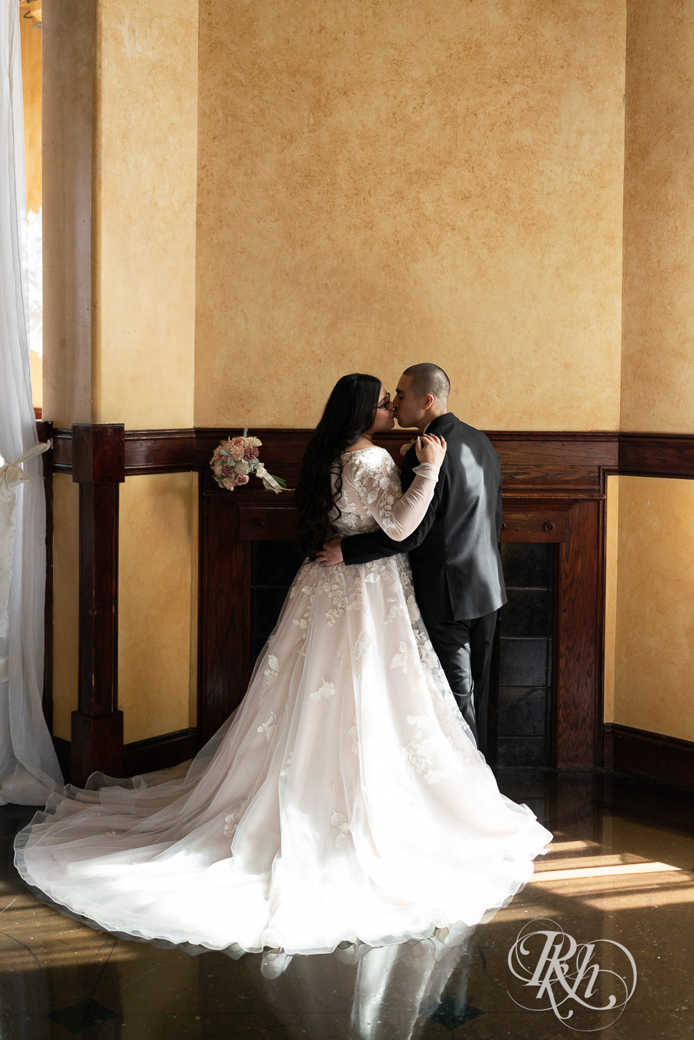 Mexican bride and groom kissing at the Historic Concord Exchange in Saint Paul, Minnesota.