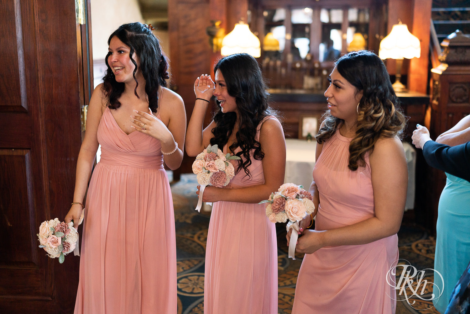 Bridesmaids crying after wedding ceremony at the Historic Concord Exchange in Saint Paul, Minnesota.
