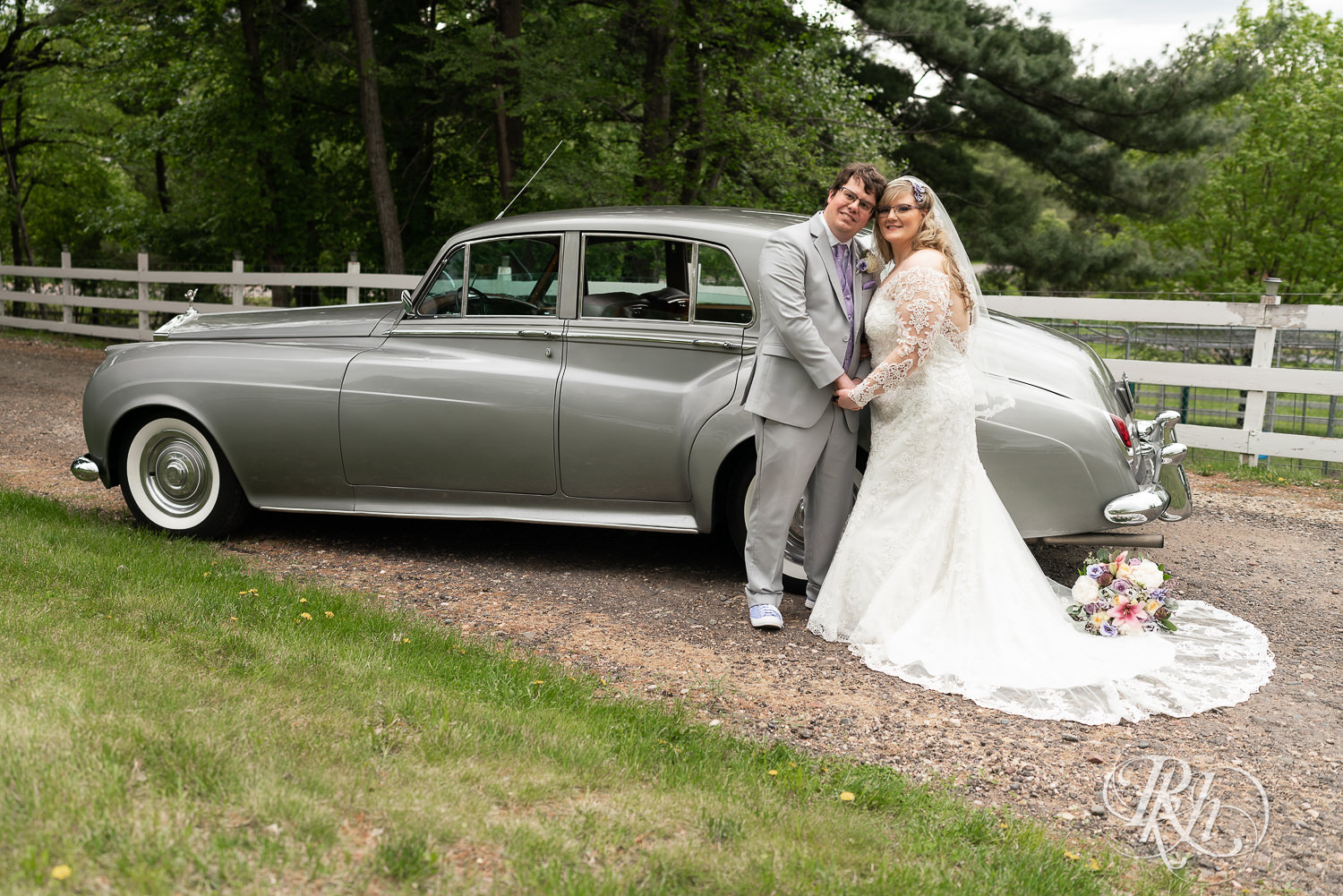 Bride and groom in front of Rolls Royce at Hope Glen Farm in Cottage Grove, Minnesota.