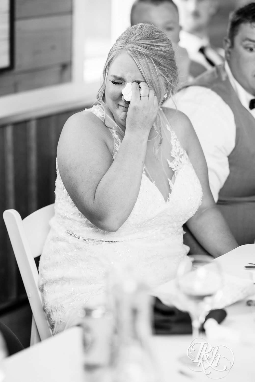 Bridesmaids crying during reception at Barn at Mirror Lake in Mondovi, Wisconsin.