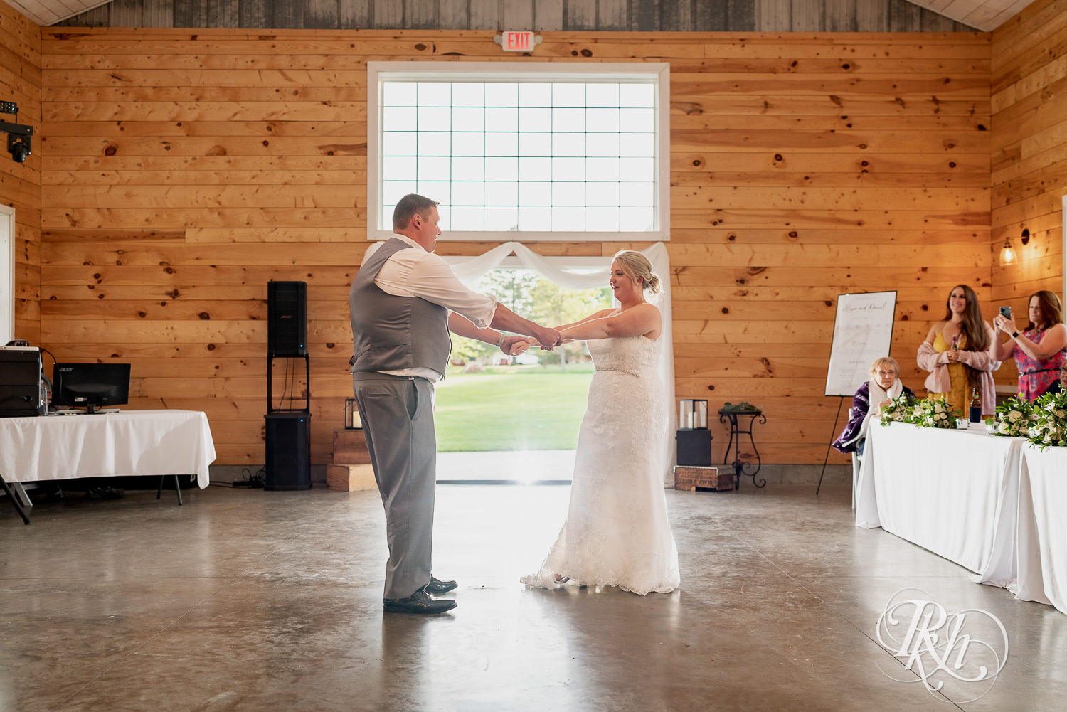 Bride and groom share first dance at Barn at Mirror Lake in Mondovi, Wisconsin.