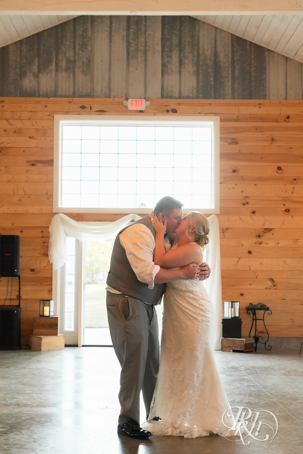 Bride and groom share first dance at Barn at Mirror Lake in Mondovi, Wisconsin.