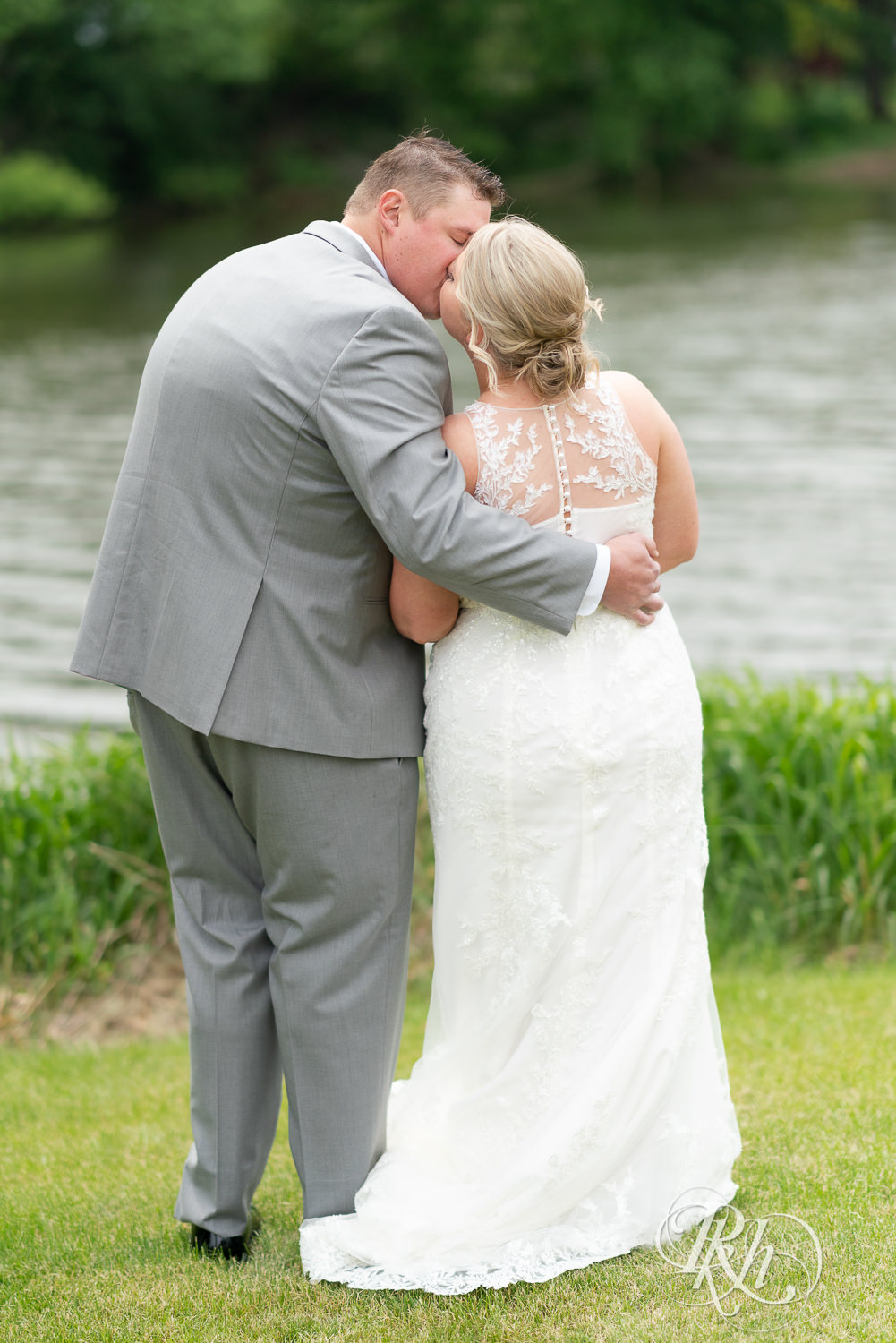 Bride and groom kiss at Barn at Mirror Lake in Mondovi, Wisconsin.