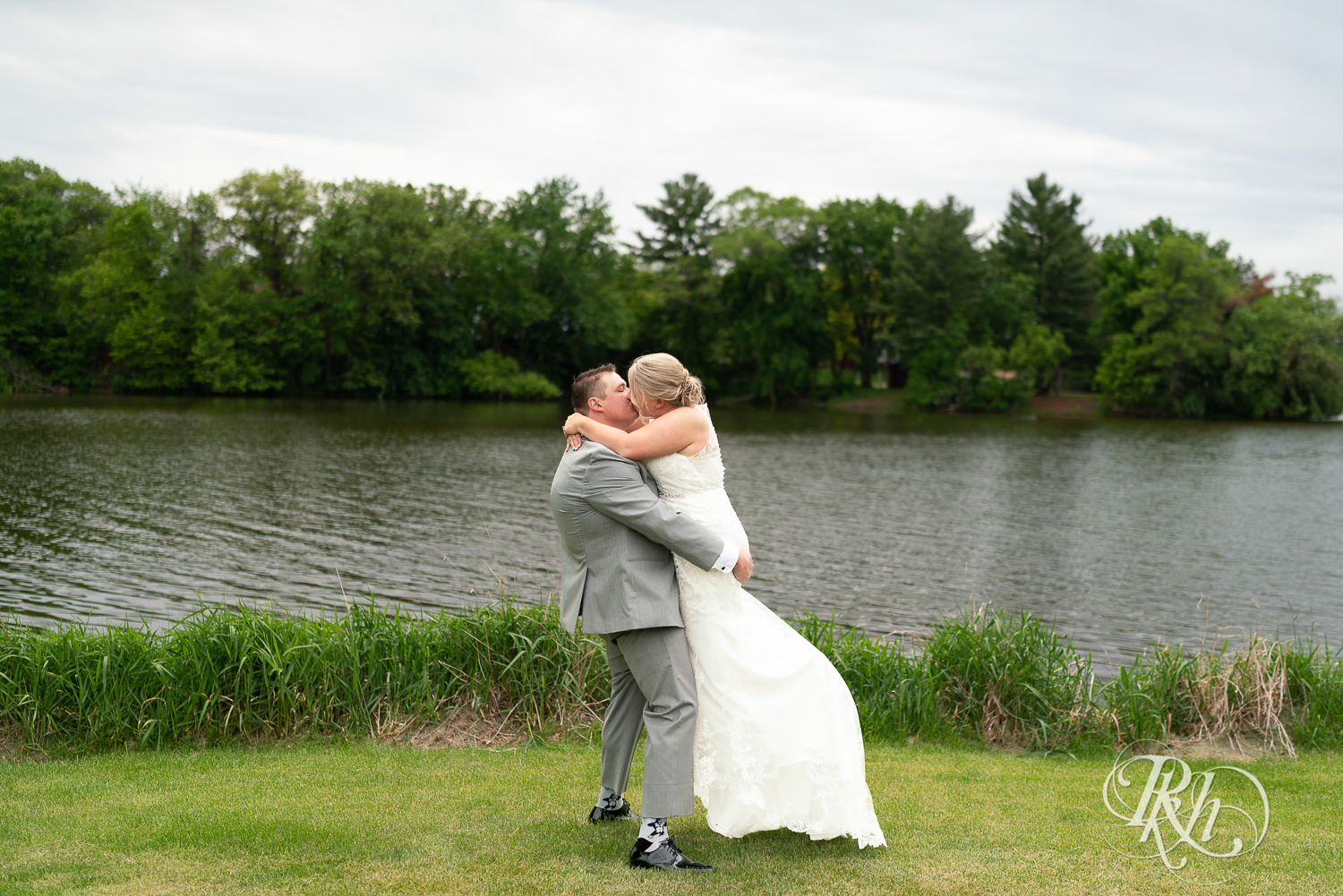 Bride and groom kiss at Barn at Mirror Lake in Mondovi, Wisconsin.