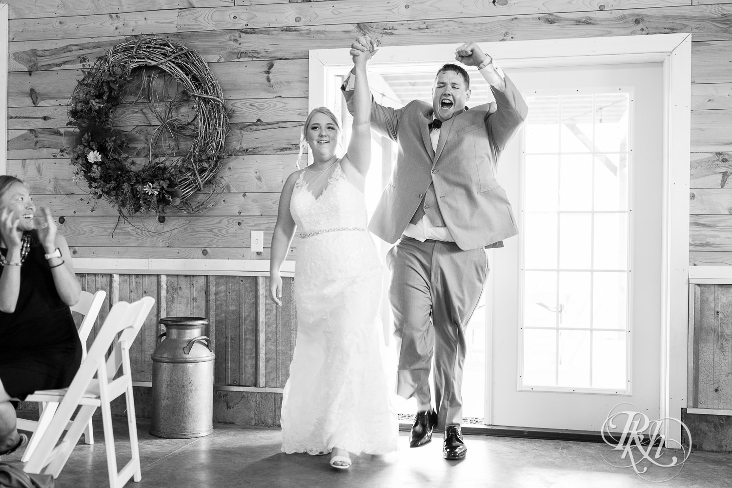 Bride and groom make grand entrance at Barn at Mirror Lake in Mondovi, Wisconsin.