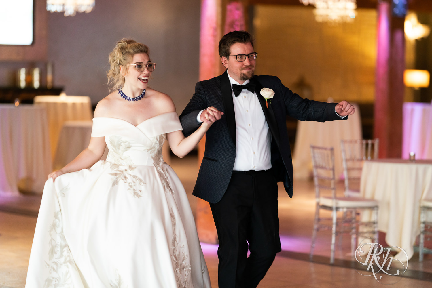 Bride and groom dance into grand entrance inside Abulae in Saint Paul, Minnesota.