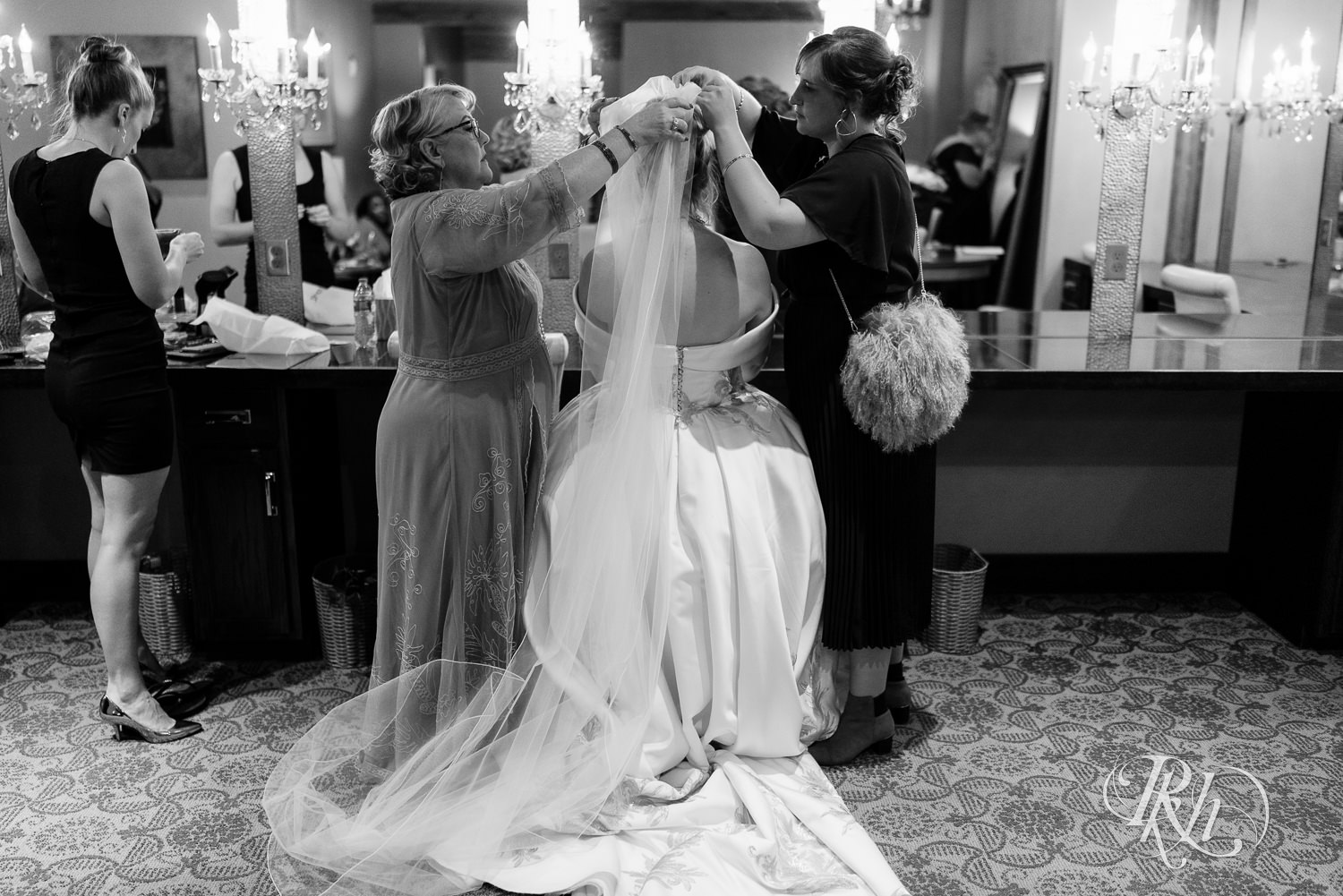 Bride getting ready before wedding ceremony at Abulae in Saint Paul, Minnesota.