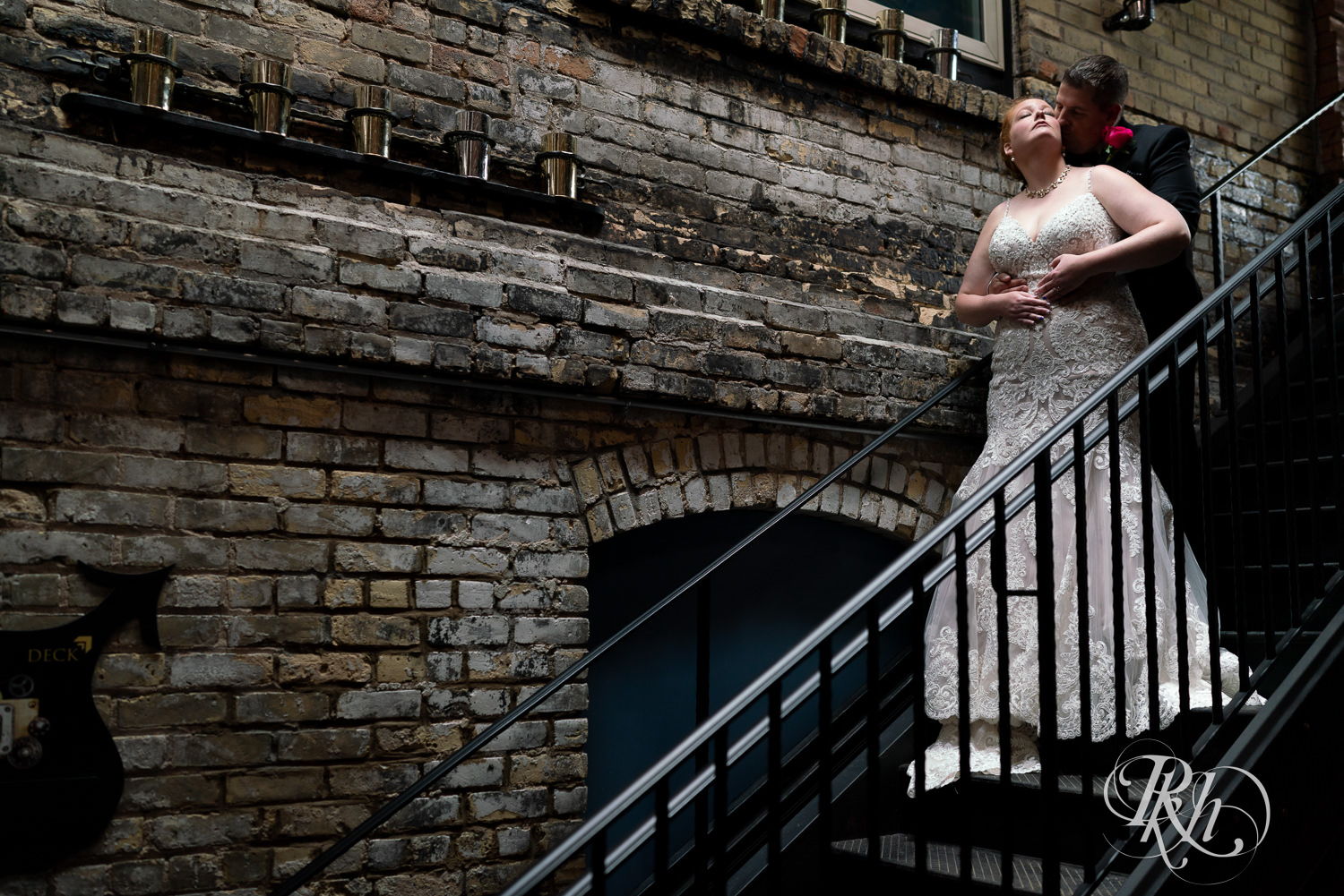 Bride and groom on stairs at Kellerman's Event Center in White Bear Lake, Minnesota.