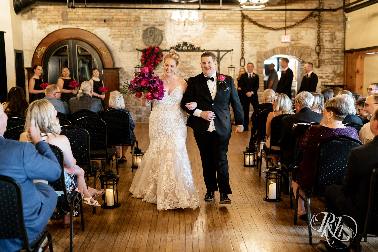 Bride and groom walking down aisle after ceremony at Kellerman's Event Center in White Bear Lake, Minnesota.