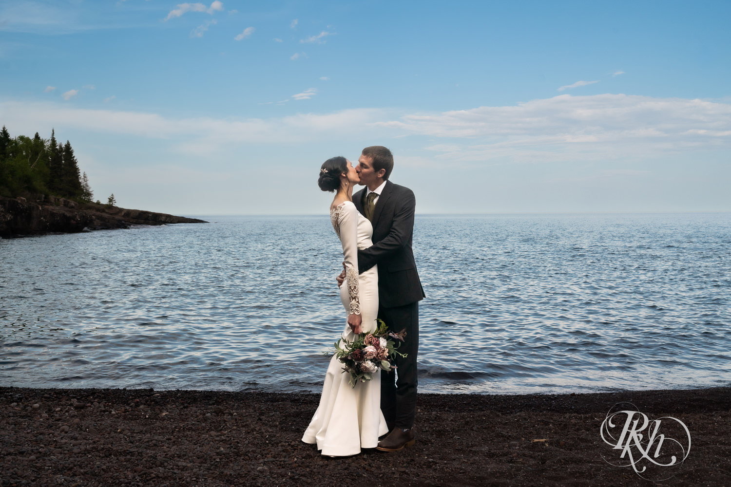 Bride and groom kiss at their North Shore elopement in Tofte, Minnesota.
