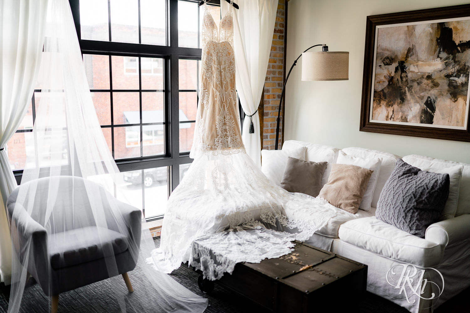 Wedding dress hanging in window at Hotel Crosby in Stillwater, Minnesota.