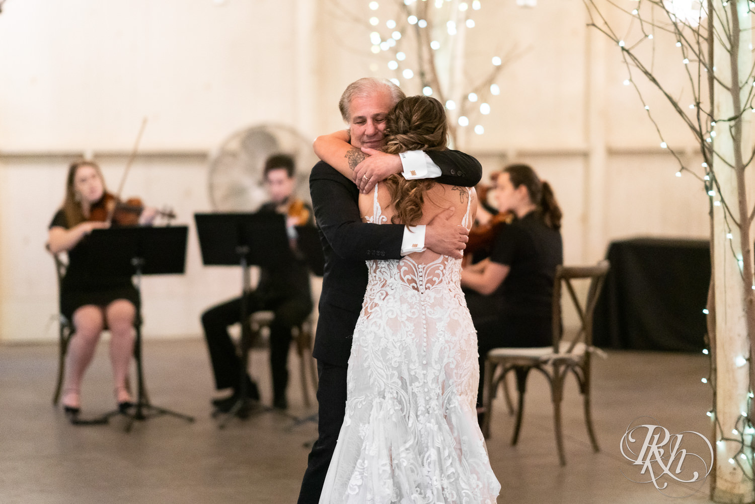 Father and daughter dance at Camrose Hill Flower Farm in Stillwater, Minnesota.