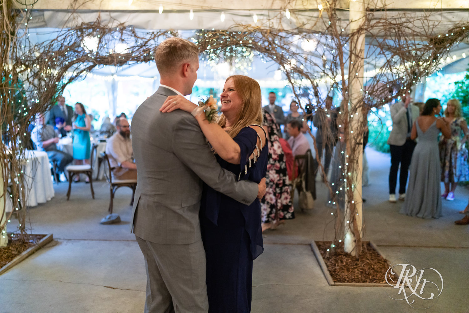 Mother and son dance at Camrose Hill Flower Farm in Stillwater, Minnesota.