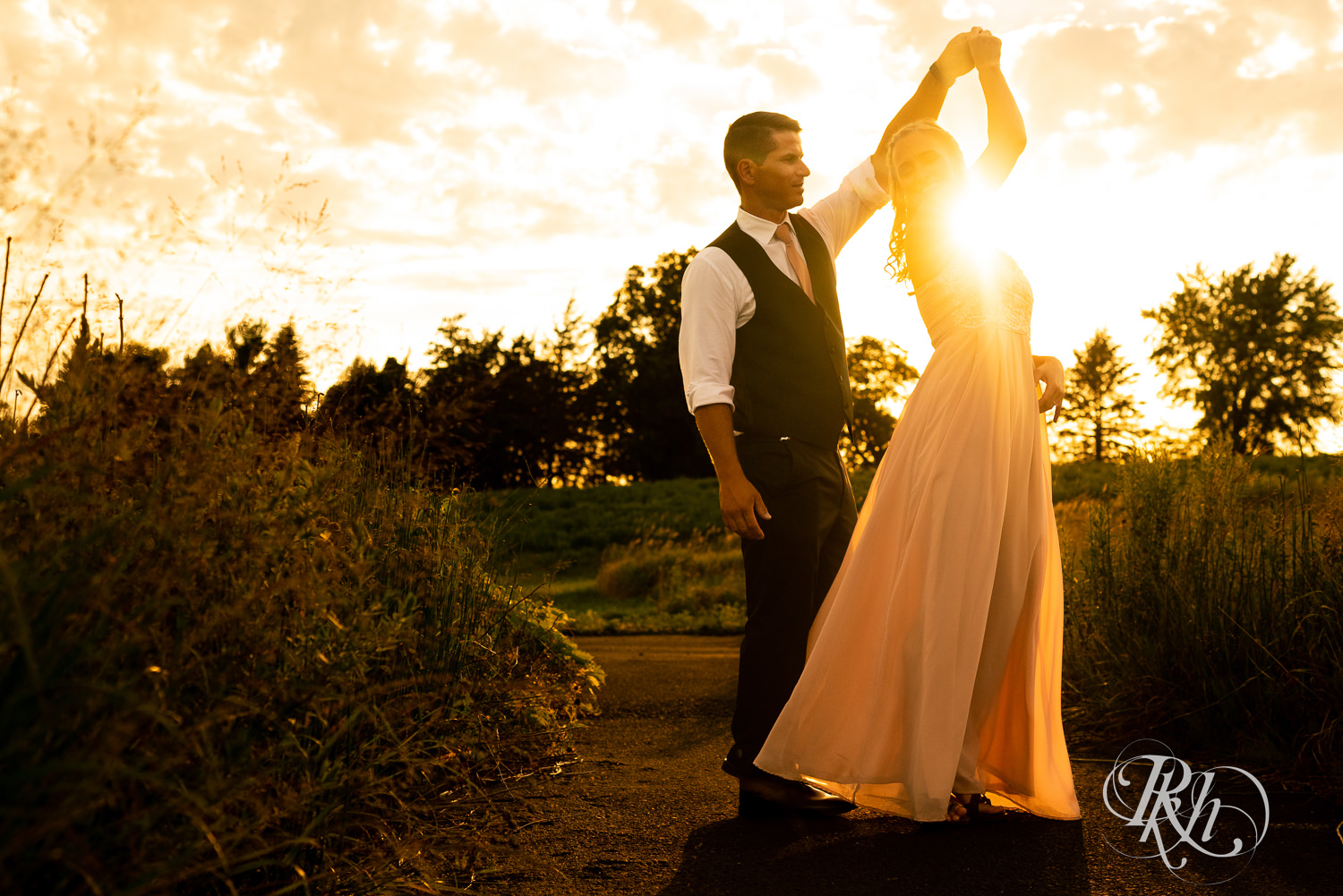 Bride and groom dancing at sunset at The Outpost Center in Chaska, Minnesota.