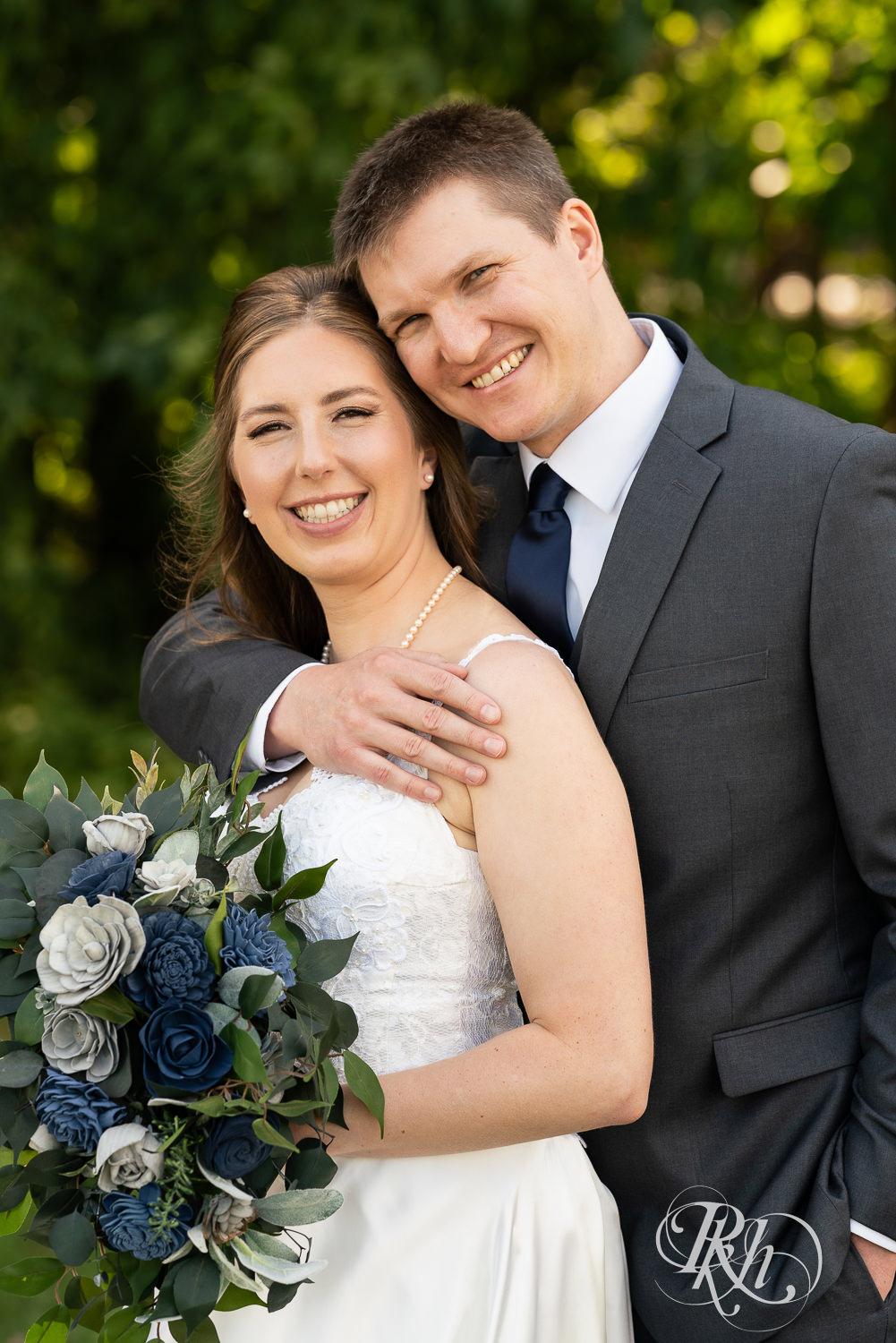 Bride and groom at a summer wedding at Stone Lion Winery and Events in Isanti, Minnesota. 