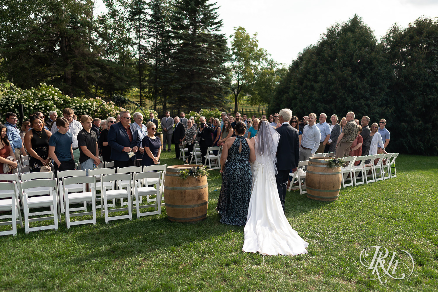 Bride walking down the aisle at Stone Lion Winery and Events in Isanti, Minnesota. 