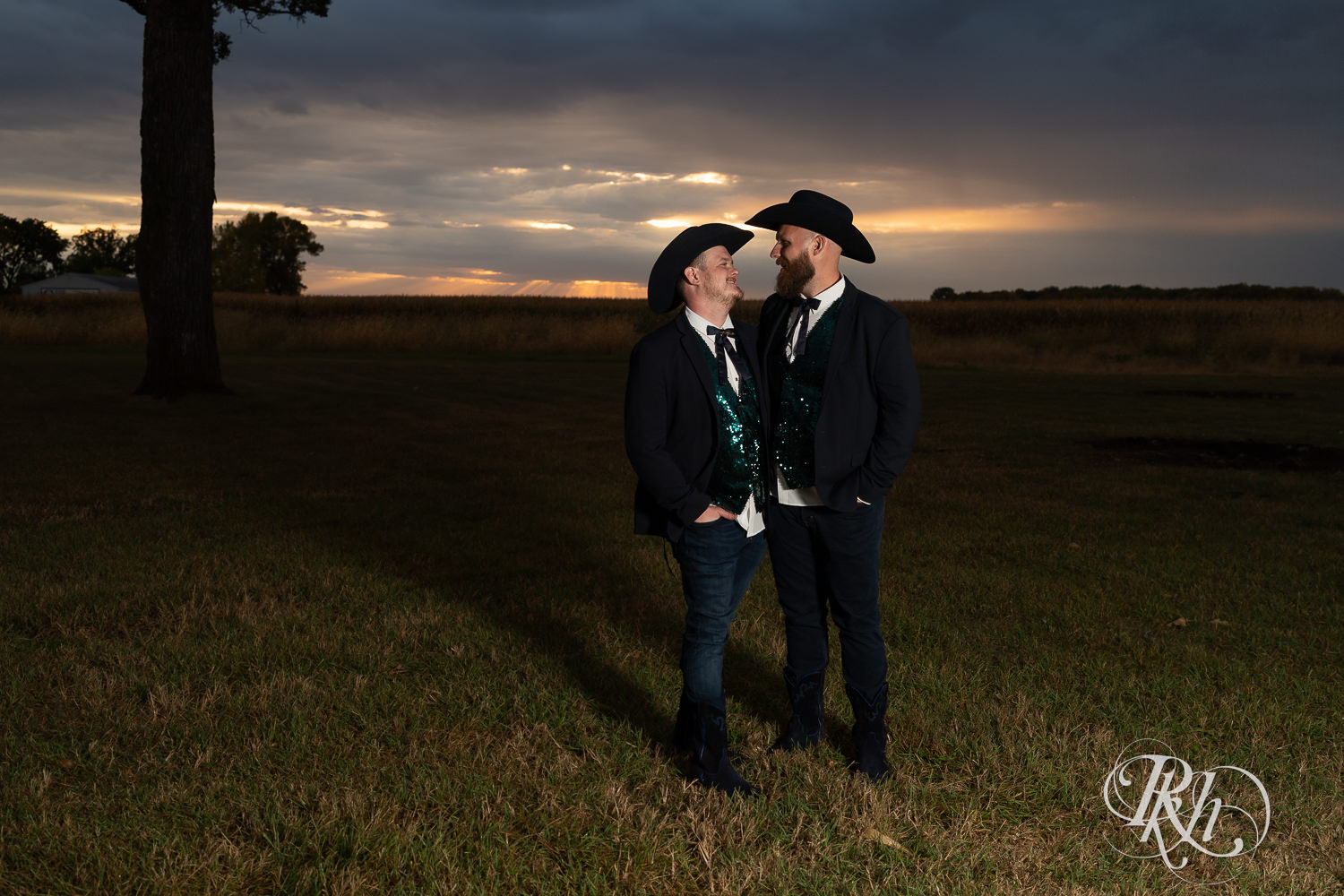 Grooms looking at each other during sunset on their wedding day.