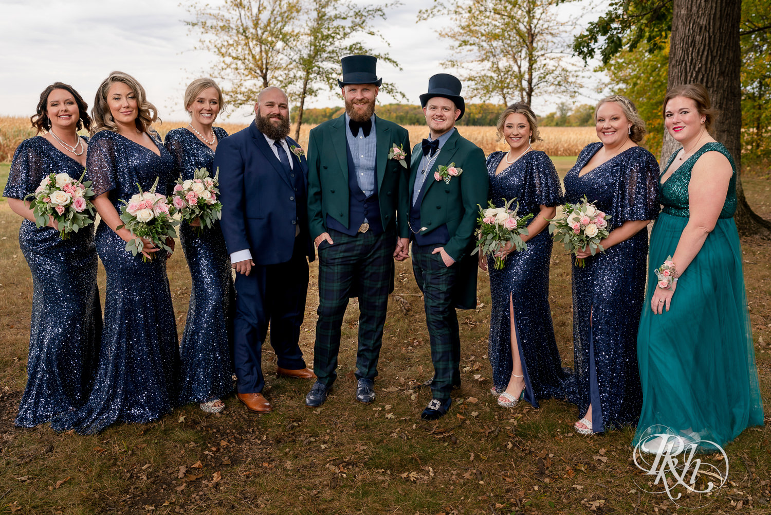 Gay wedding party with grooms wearing tophats and bridesmaids wearing sequin dresses.