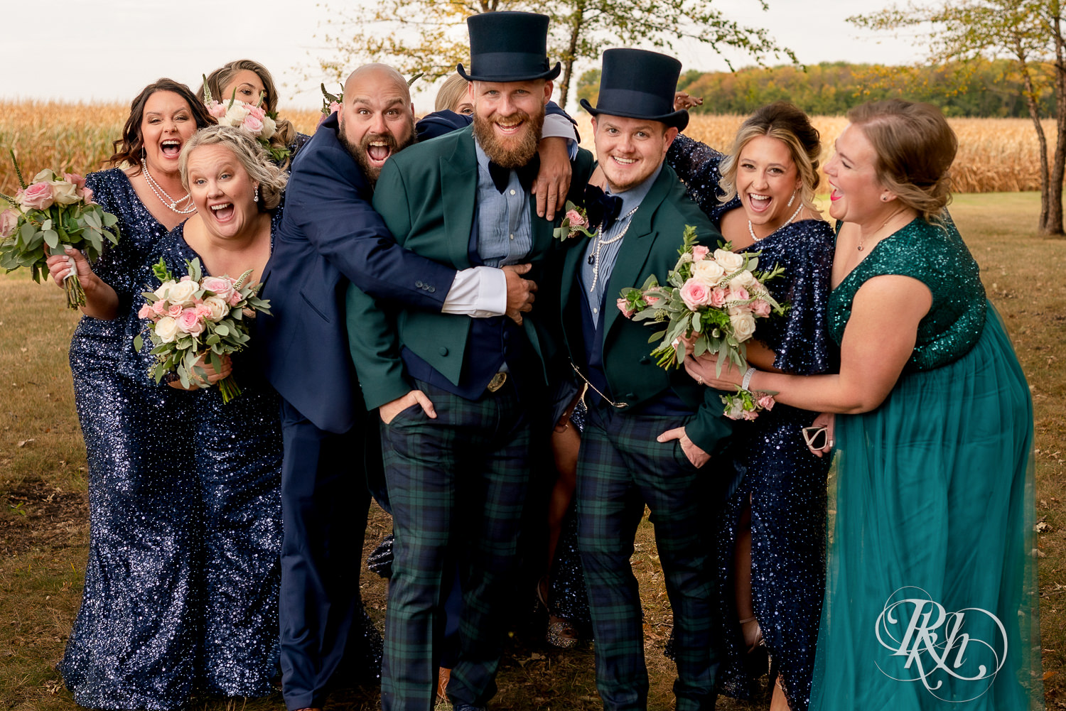 Gay wedding party with grooms wearing top hats and bridesmaids wearing sequin dresses.