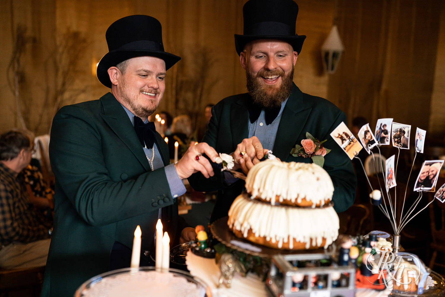 Grooms cutting cake at their wedding in Belle Plaine, Minnesota.