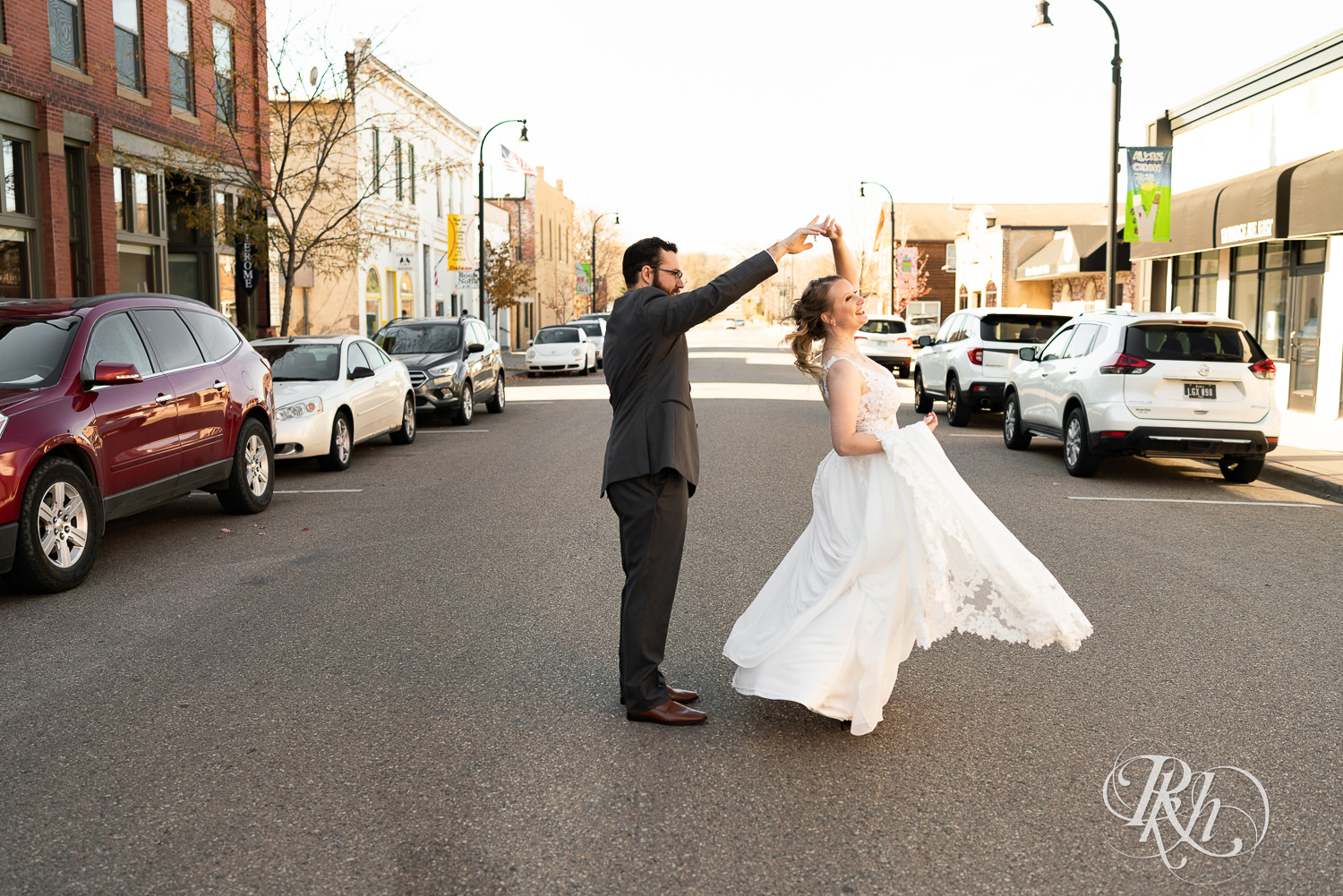 Bride and groom dancing in front of The Jerome Event Center in Delano, Minnesota.