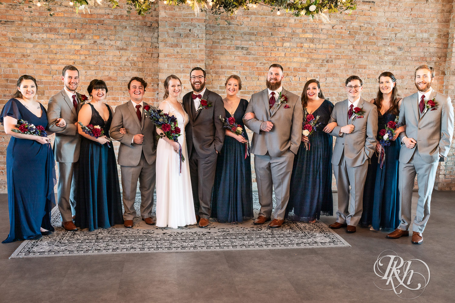 Wedding party dressed in blue and gray at The Jerome Event Center in Delano, Minnesota.