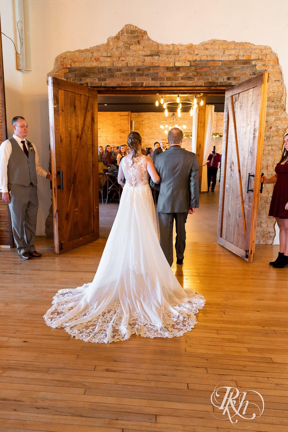 Bride walking down the aisle with her dad at The Jerome Event Center in Delano, Minnesota.